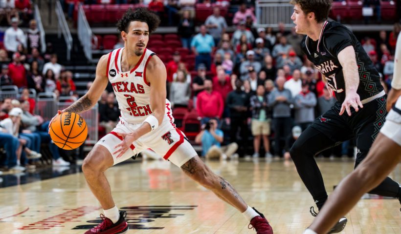 LUBBOCK, TEXAS - DECEMBER 06: Pop Isaacs #2 of the Texas Tech Red Raiders handles the ball during the first half of the game against the Omaha Mavericks at United Supermarkets Arena on December 06, 2023 in Lubbock, Texas. (Photo by John E. Moore III/Getty Images)