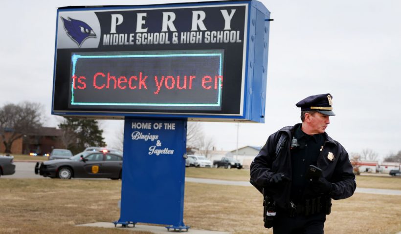 PERRY, IOWA - JANUARY 04: A police officer stands guard outside the Perry Middle School and High School complex following a school shooting on January 04, 2024 in Perry, Iowa. Students were returning to classes today following the holiday break. (Photo by Scott Olson/Getty Images)