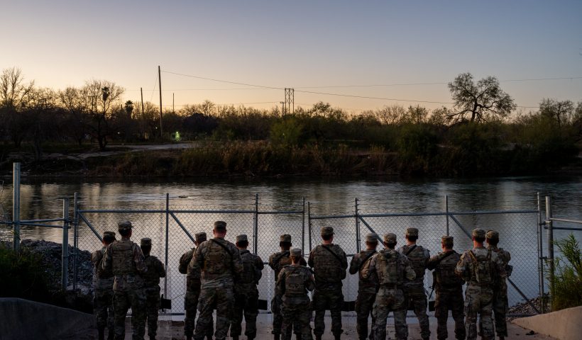 EAGLE PASS, TEXAS - JANUARY 12: National Guard soldiers stand guard on the banks of the Rio Grande river at Shelby Park on January 12, 2024 in Eagle Pass, Texas. The Texas National Guard continues its blockade and surveillance of Shelby Park in an effort to deter illegal immigration. The Department of Justice has accused the Texas National Guard of blocking Border Patrol agents from carrying out their duties along the river. (Photo by Brandon Bell/Getty Images)