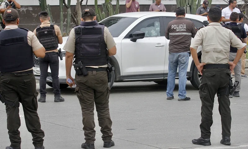ECUADOR-STATE OF EMERGENCY-SECURITY-MURDER-PROSECUTOR-SUAREZ Members of the National Police inspect the car in which Prosecutor Cesar Suarez was at the moment he was shot dead in Guayaquil, Ecuador on January 17, 2024. A prosecutor charged with investigating the dramatic live-broadcast armed assault last week on an Ecuadoran television station was shot dead Wednesday, the country's attorney general said. "In the face of the murder of our colleague Cesar Suarez ... I am going to be emphatic: organized crime groups, criminals, terrorists will not stop our commitment to Ecuadoran society," said Attorney General Diana Salazar in a statement on X. (Photo by STRINGER / AFP) (Photo by STRINGER/AFP via Getty Images)
