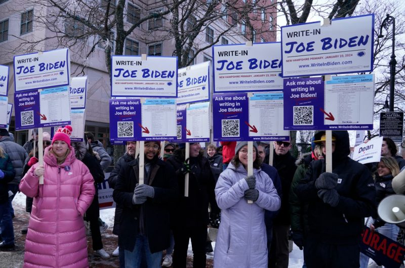 Supporters demonstrate at a Joe Biden Write-In Rally in Manchester, New Hampshire, on January 20, 2024. US President Joe Biden will not be on New Hampshire's January 23 primary ballot, but supporters are organizing a write-in campaign. (Photo by TIMOTHY A. CLARY / AFP) (Photo by TIMOTHY A. CLARY/AFP via Getty Images)