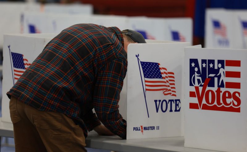 BEDFORD, NEW HAMPSHIRE - JANUARY 23: A voter fills out their ballot at a polling location at Bedford High School on January 23, 2024 in Bedford, New Hampshire. Voters headed to the polls as New Hampshire holds its primary. (Photo by Joe Raedle/Getty Images)