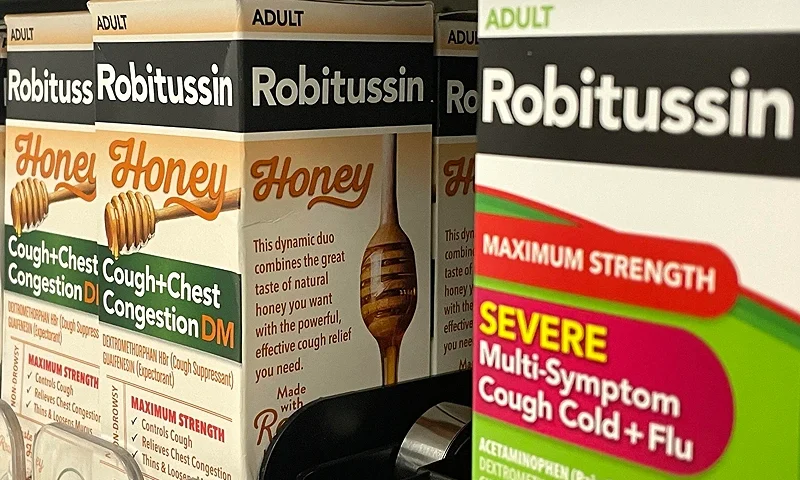 SAN BRUNO, CALIFORNIA - JANUARY 25: Packages of Robitussin Honey are displayed on a shelf at a Target store on January 25, 2024 in San Bruno, California. Haleon, maker of Robitussin cough medicine, has announced a recall of certain Robitussin cough syrups due to a possible microbial contamination that could lead to deadly infections for at-risk customers. (Photo by Justin Sullivan/Getty Images)