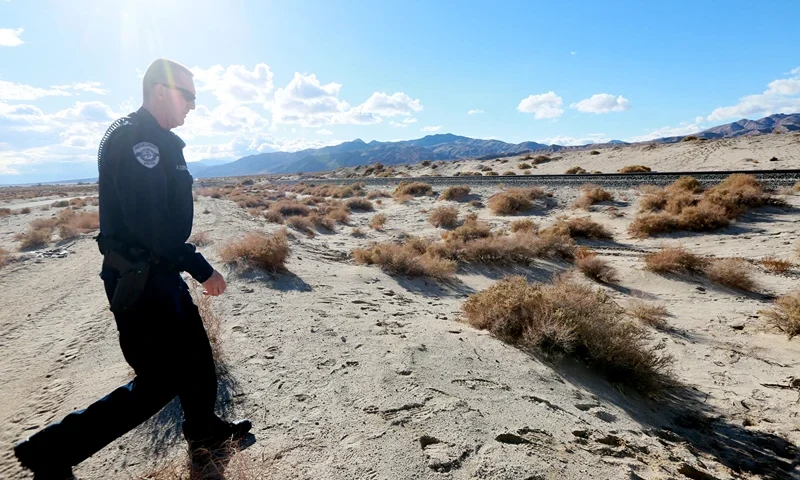MOJAVE, CA - NOVEMBER 1: A sheriff's deputy surveys the area nea to the crash site of SpaceShipTwo out in a desert field on November 1, 2014, in Mojave, California. The Virgin Galactic SpaceShipTwo crashed on October 31, 2014 during a test flight, killing one pilot and seriously injuring another. (Photo by Sandy Huffaker/Getty Images)
