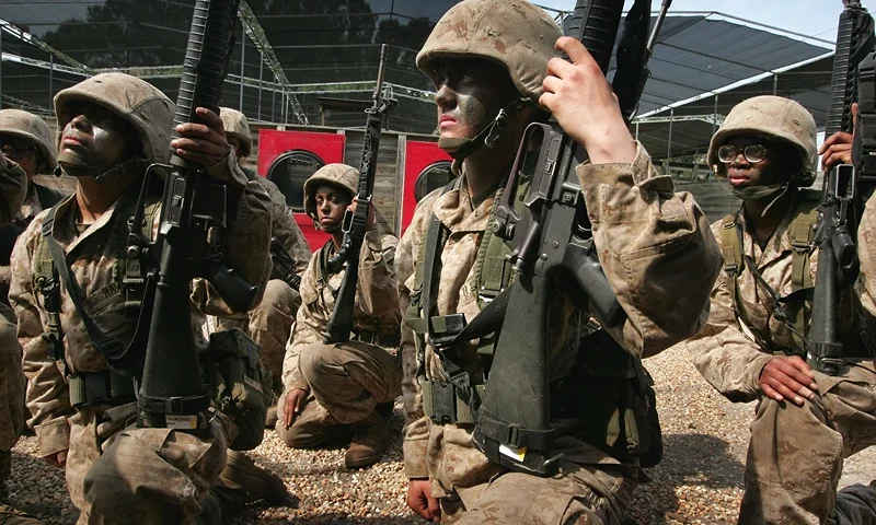 PARRIS ISLAND, SC - MARCH 08: Female United States Marine Corps recruits receive instructions for a training exercise during boot camp March 8, 2007 at Parris Island, South Carolina. The Department of Defense has asked Congress to increase the size of the Marine Corps by 27,000 troops and the Army by 65,000 over the next five years. (Photo by Scott Olson/Getty Images)