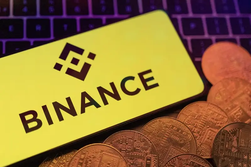 Smartphone with displayed Binance logo and representation of cryptocurrencies are placed on a keyboard in this illustration taken, June 8, 2023. REUTERS/Dado Ruvic/Illustration/File Photo