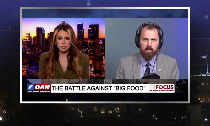 Video still from In Focus on One America News Network showing a split screen of the host on the left side, and on the right side is the guest, Chris Hume.