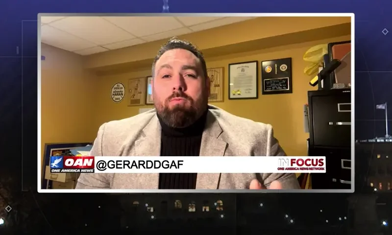 Video still from In Focus on One America News Network during an interview with the guest, Gerard Michaels and Michael Loftus.