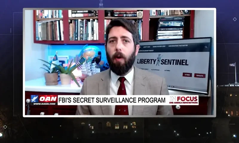 Video still from In Focus on One America News Network during an interview with the guest, Alex Newman.