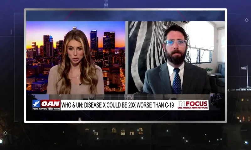 Video still from In Focus on One America News Network showing a split screen of the host on the left side, and on the right side is the guest, Alex Newman.