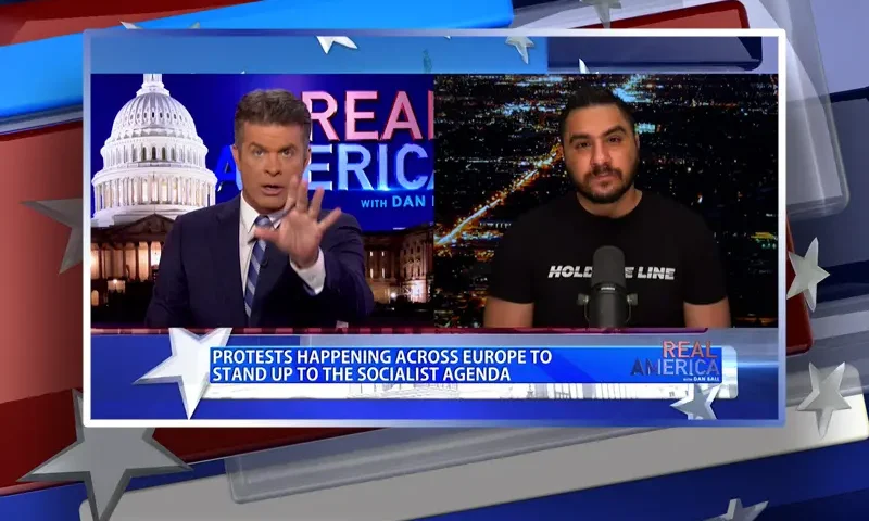 Video still from Real America on One America News Network showing a split screen of the host on the left side, and on the right side is the guest, Drew Hernandez.