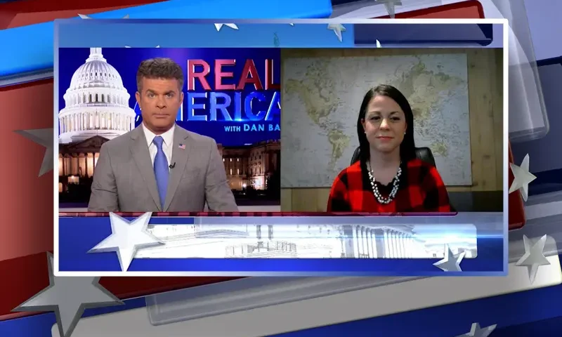 Video still from Real America on One America News Network showing a split screen of the host on the left side, and on the right side is the guest, Misti Allison.