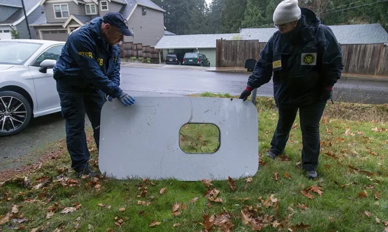 This photo released by the National Transportation Safety Board shows the door plug from Alaska Airlines Flight 1282 on Monday, Jan. 8, 2024, in Portland, Ore. A panel used to plug an area reserved for an exit door on the Boeing 737 Max 9 jetliner blew out Jan. 5, shortly after the flight took off from Portland, forcing the plane to return to Portland International Airport. (National Transportation Safety Board via AP)