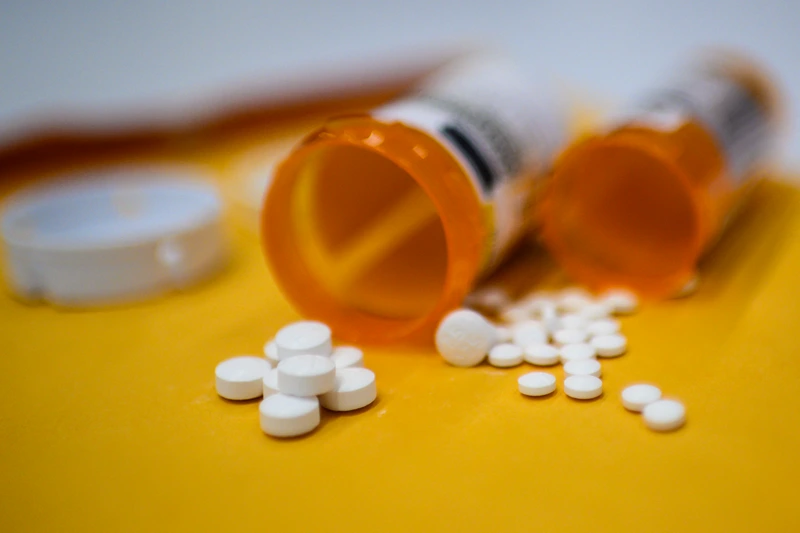 US-HEALTH-OPIOID-OXYCODON-ILLUSTRATION
This illustration image shows tablets of opioid painkiller Oxycodone delivered on medical prescription taken on September 18, 2019 in Washington,DC. - Millions of Americans sank into addiction after using potent opioid painkillers that the companies churned out and doctors freely prescribed over the past two decades. Well over 400,000 people died of opioid overdoses in that period, while the companies involved raked in billions of dollars in profits. And while the flood of prescription opioids into the black market has now been curtailed, addicts are turning to heroin and highly potent fentanyl to compensate, where the risk of overdose and death is even higher. (Photo by Eric BARADAT / AFP) (Photo by ERIC BARADAT/AFP via Getty Images)