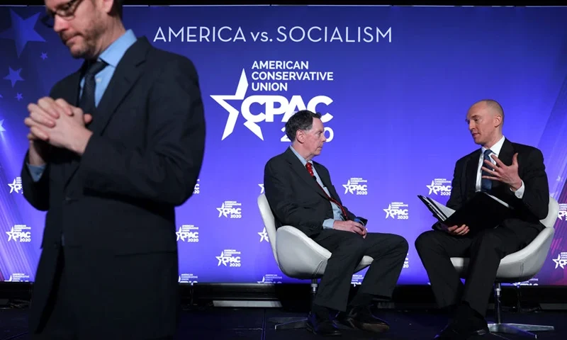 NATIONAL HARBOR, MARYLAND - FEBRUARY 26: Former Trump Campaign foreign policy adviser Carter Page participates in a discussion with Rowan Scarborough of the Washington Times as a sign language interpreter is seen during the CPAC Direct Action Training at the annual Conservative Political Action Conference at Gaylord National Resort & Convention Center February 26, 2020 in National Harbor, Maryland. U.S. President Donald Trump is expected to address the annual event on February 29th. (Photo by Alex Wong/Getty Images)