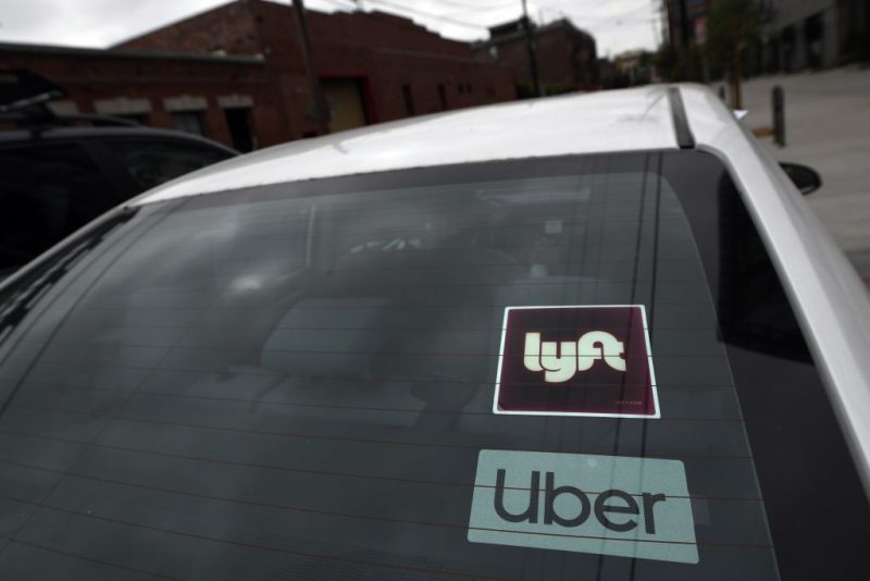 Rideshare drivers demonstrate against rideshare companies Uber and Lyft during a car caravan protest on August 6, 2020 in Los Angeles. - The drivers, organized by the Mobile Workers Alliance and Rideshare Drivers United unions, say Uber and Lyft's are pushing a "deceptive" November ballot initiative, which, if passed, they claim would "rewrite labor law" and turn app-based drivers into independent contractors, exempting companies such as Lyft and Uber from standard wage and hour restrictions. (Photo by Robyn Beck / AFP) (Photo by ROBYN BECK/AFP via Getty Images)