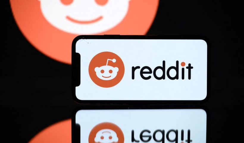 A picture taken on October 5, 2021 in Toulouse shows the logo of Reddit social media displayed by a by a tablet and a smartphone. (Photo by Lionel BONAVENTURE / AFP) (Photo by LIONEL BONAVENTURE/AFP via Getty Images)