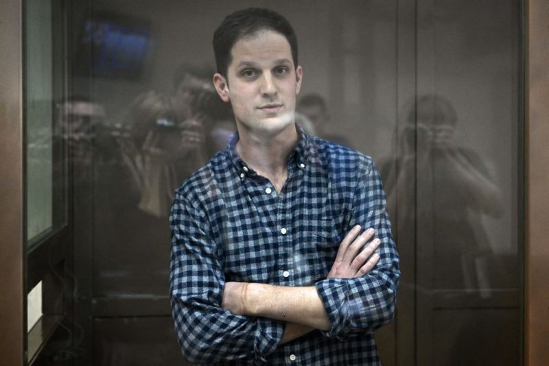 TOPSHOT - US journalist Evan Gershkovich, arrested on espionage charges, stands inside a defendants' cage before a hearing to consider an appeal on his arrest at the Moscow City Court in Moscow on April 18, 2023. (Photo by NATALIA KOLESNIKOVA / AFP) (Photo by NATALIA KOLESNIKOVA/AFP via Getty Images)