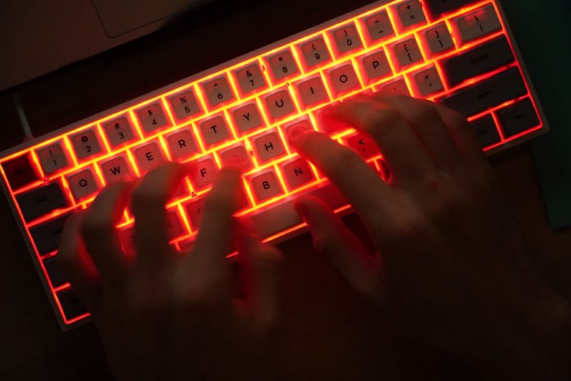 BERLIN, GERMANY - JANUARY 25: In this photo illustration a young man types on an illuminated computer keyboard typically favored by computer coders on January 25, 2021 in Berlin, Germany. 2020 saw a sharp rise in global cybercrime that was in part driven by the jump in online retailing that ensued during national lockdowns as governments sought to rein in the coronavirus pandemic. (Photo by Sean Gallup/Getty Images)
