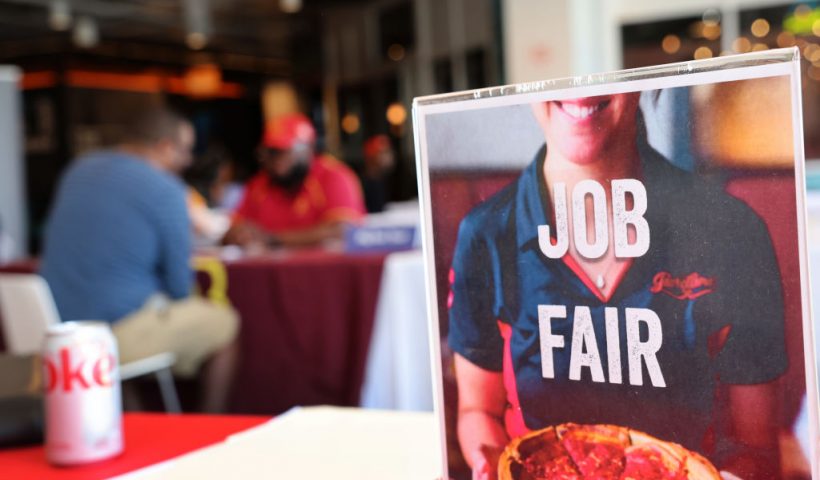 CHICAGO, ILLINOIS - APRIL 11: Job seekers speak with recruiters during a job fair at Navy Pier on April 11, 2023 in Chicago, Illinois. Companies at the fair were seeking mostly seasonal employees to work in tourism related fields. The U.S. unemployment rate currently stands at 3.5%. (Photo by Scott Olson/Getty Images)