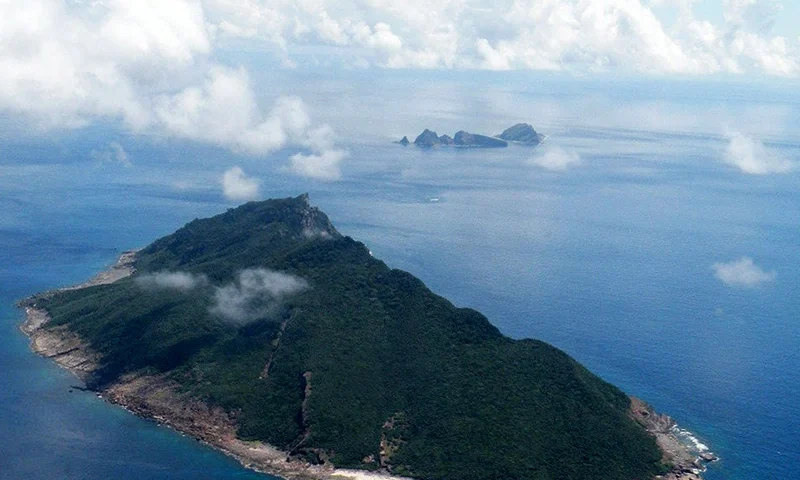 This aerial shot taken on September 15, 2010 shows the disputed islands known as Senkaku in Japan and Diaoyu in China in the East China Sea. China pledged on September 5, 2012 to take "necessary measures" to defend its territory after Japanese media said Tokyo had agreed to buy a contested group of islands. AFP PHOTO / JIJI PRESS JAPAN OUT (Photo credit should read JIJI PRESS/AFP/GettyImages)