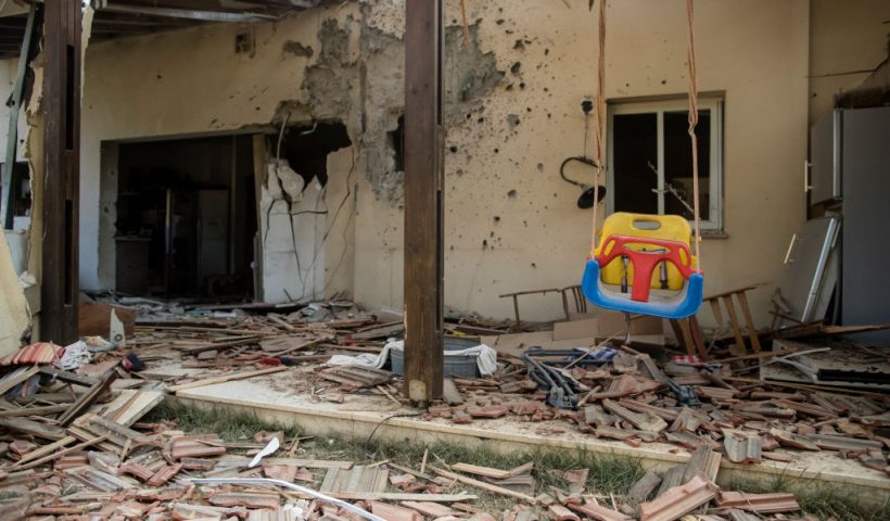 BE'ERI, ISRAEL - OCTOBER 14: A baby swing is hanging near a house that was destroyed in a battle between Israeli soldiers and Palestinian militants on Saturday's Hamas attack on the kibbutz on October 14, 2023 in Be'eri, Israel. Israel has sealed off Gaza and launched sustained retaliatory air strikes, which have killed at least 1,400 people with more than 400,000 displaced, after a large-scale attack by Hamas. On October 7, the Palestinian militant group Hamas launched a surprise attack on Israel from Gaza by land, sea, and air, killing over 1,300 people and wounding around 2,800. Israeli soldiers and civilians have also been taken hostage by Hamas and moved into Gaza. The attack prompted a declaration of war by Israeli Prime Minister Benjamin Netanyahu and the announcement of an emergency wartime government. (Photo by Amir Levy/Getty Images)