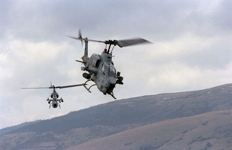 BOSNIA - APRIL 2: (FILE PHOTO) This handout photo from the U.S. Department of Defense shows two U.S. Marine AH-1W Super Cobra helicopters from the 26th Marine Expeditionary Unit training on April 2, 1998 in Bosnia. According to media reports, two Marine helicopters of this type crashed on January 22, 2003 near Zapata, Texas. Reports say that the aircraft were conducting a night time-time operation in conjunction with the U.S. Border Patrol in a drug smuggling case the agency was working on. All four Marines onboard the two helicopters were killed. (Photo by Steve Briggs/U.S. Navy/Getty Images)