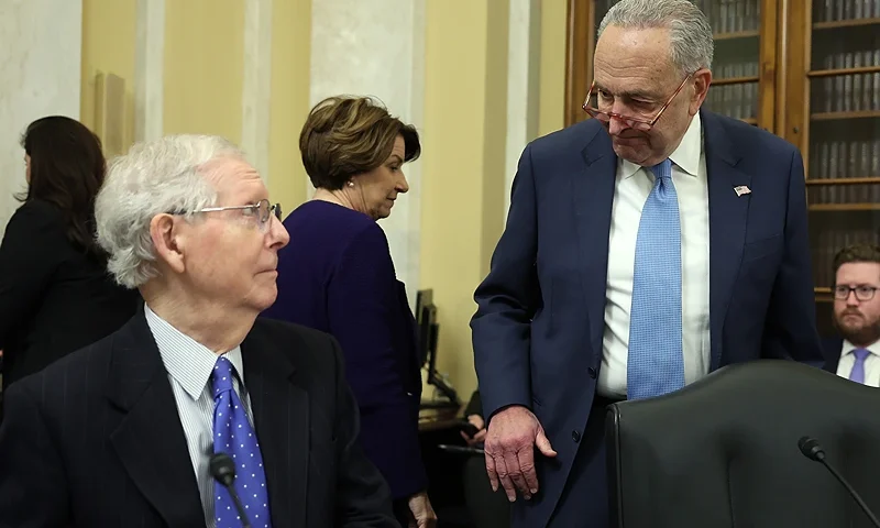 WASHINGTON, DC - NOVEMBER 14: (L-R) U.S. Senate Minority Leader Mitch McConnell (R-KY) and Senate Majority Leader Charles Schumer (D-NY) arrive for a Rules Committee hearing at the Russell Senate Office Building on November 14, 2023 in Washington, DC. The Rules Committee voted to change the rules of the Senate to end Sen. Tommy Tuberville’s (R-AL) months-long blockade of military nominees. (Photo by Kevin Dietsch/Getty Images)