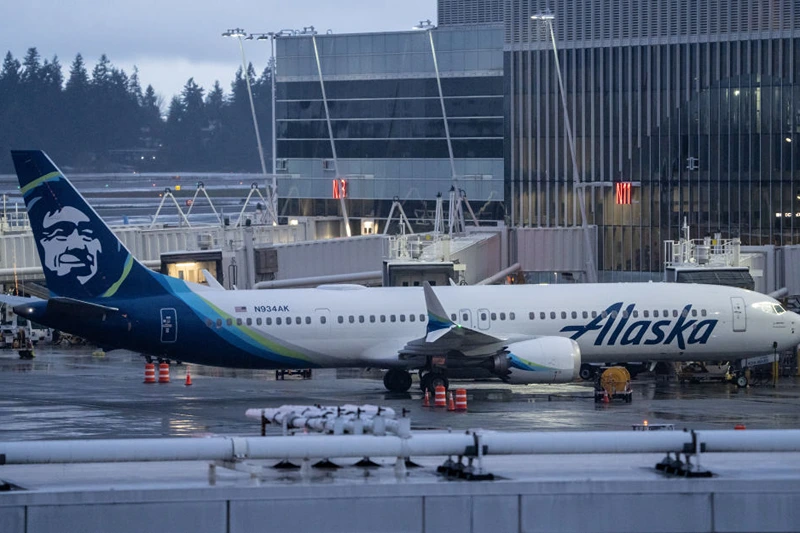 SEATTLE, WASHINGTON - JANUARY 6: An Alaska Airlines Boeing 737 MAX 9 plane sits at a gate at Seattle-Tacoma International Airport on January 6, 2024 in Seattle, Washington. Alaska Airlines grounded its 737 MAX 9 planes after part of a fuselage blew off during a flight from Portland Oregon to Ontario, California. (Photo by Stephen Brashear/Getty Images)