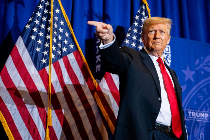 ATKINSON, NEW HAMPSHIRE - JANUARY 16: Republican presidential candidate, former U.S. President Donald Trump points to supporters at the conclusion of a campaign rally at the Atkinson Country Club on January 16, 2024 in Atkinson, New Hampshire. Trump won this week's Iowa caucus, solidifying him as the lead Republican nominee in the first balloting of 2024. The former U.S. President heads to Atkinson, New Hampshire today as he continues campaigning during the primary election. (Photo by Brandon Bell/Getty Images)