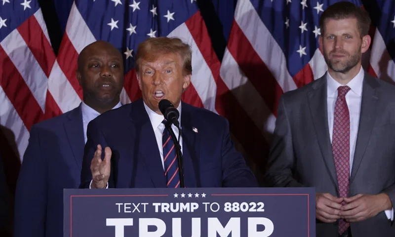 NASHUA, NEW HAMPSHIRE - JANUARY 23: Republican presidential candidate and former U.S. President Donald Trump delivers remarks alongside supporters, campaign staff and family members during his primary night rally at the Sheraton on January 23, 2024 in Nashua, New Hampshire. New Hampshire voters cast their ballots in their state's primary election today. With Florida Governor Ron DeSantis dropping out of the race Sunday, former President Donald Trump and former UN Ambassador Nikki Haley are battling it out in this first-in-the-nation primary. Trump was joined by U.S. Sen. Tim Scott (R-SC) and Eric Trump. (Photo by Alex Wong/Getty Images)