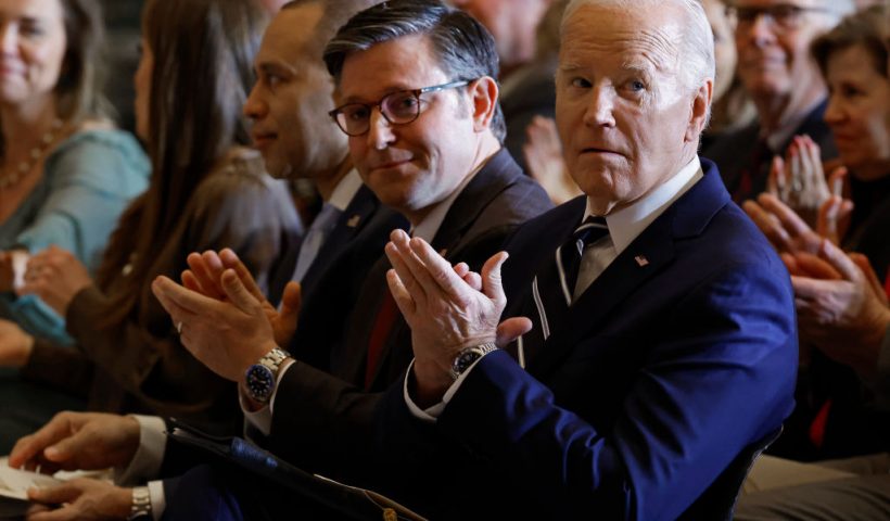 WASHINGTON, DC - FEBRUARY 01: U.S. President Joe Biden (R) and Speaker of the House Mike Johnson (R-LA) applaud for Andrea Bocelli after he performed "Amazing Grace" during the annual National Prayer Breakfast in Statuary Hall in the U.S. Capitol on February 01, 2024 in Washington, DC. The gathering of elite political, social and business leaders has been attended by every president since Dwight D. Eisenhower. This is the first year the event is being hosted by the National Prayer Breakfast Foundation inside the Capitol after being controlled for decades by the Christian evangelical group the Fellowship Foundation. (Photo by Chip Somodevilla/Getty Images)