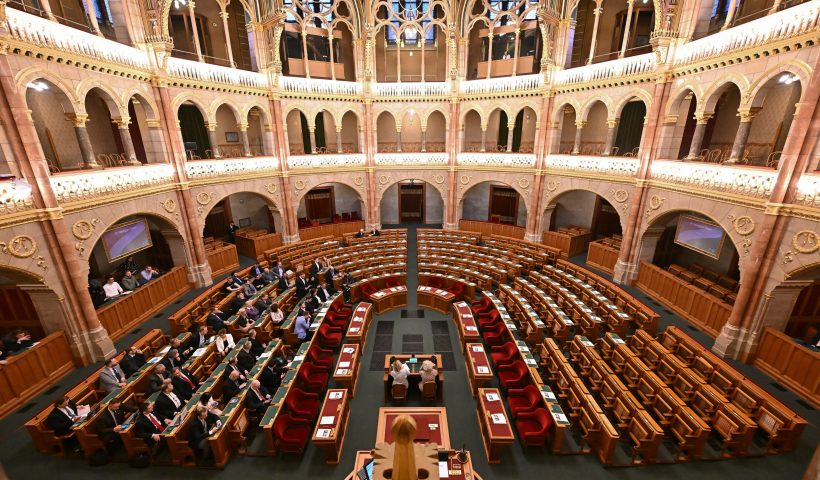 A general view taken on February 5, 2024 shows empty seats (C and R) in the plenary hall of the Hungarian Parliament in Budapest during an extraordinary sitting at the opposition's request to debate Sweden's NATO bid. Representatives of the governing FIDESZ party led by Hungarian Prime Minister Orban and the right-wing Christian Democratic party stayed away from today's session. Budapest remains the last holdout to ratify the Nordic country's bid to join the military alliance, following Turkey's ratification in January. (Photo by ATTILA KISBENEDEK / AFP) (Photo by ATTILA KISBENEDEK/AFP via Getty Images)