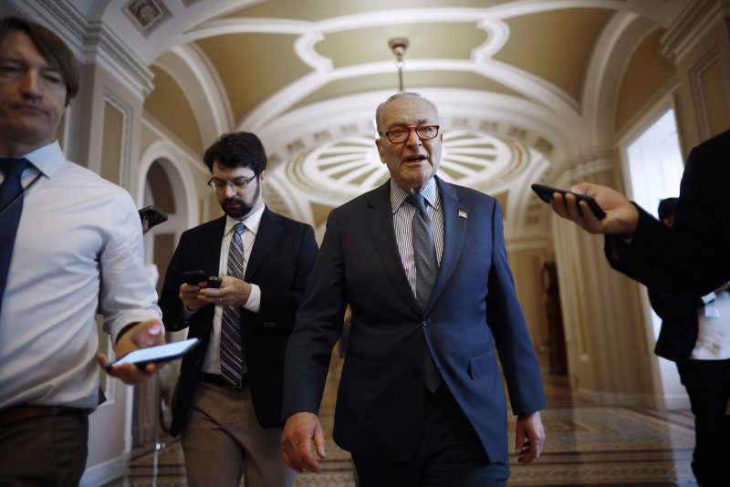 WASHINGTON, DC - FEBRUARY 07: Senate Majority Leader Charles Schumer (D-NY) talks to reporters as he walks to his office at the U.S. Capitol on February 07, 2024 in Washington, DC. In the immediate wake of the failed bipartisan border security and foreign aid legislation, Schumer said he will put up a supplemental spending bill for aid to Israel, Ukraine, and Taiwan up for a vote later on Wednesday. (Photo by Chip Somodevilla/Getty Images)