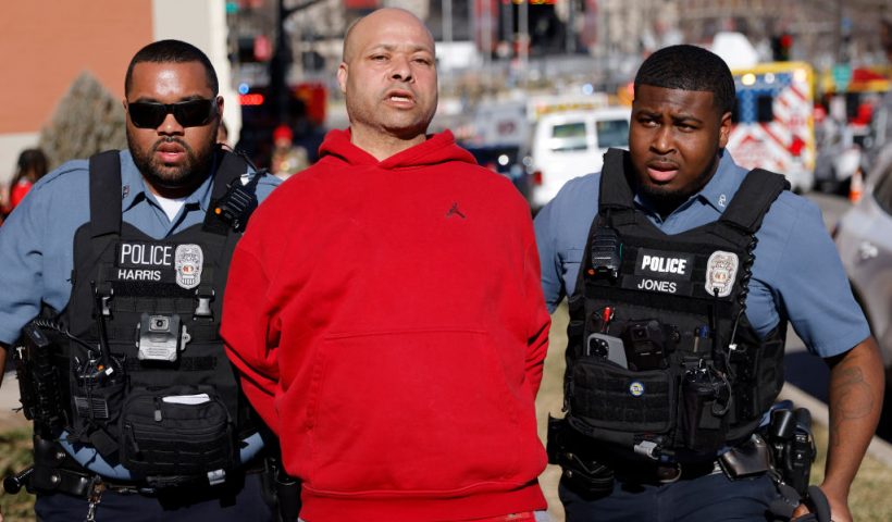 KANSAS CITY, MISSOURI - FEBRUARY 14: A man is detained by law enforcement following a shooting at Union Station during the Kansas City Chiefs Super Bowl LVIII victory parade on February 14, 2024 in Kansas City, Missouri. Several people were shot and two people were detained after a rally celebrating the Chiefs Super Bowl victory. (Photo by David Eulitt/Getty Images)