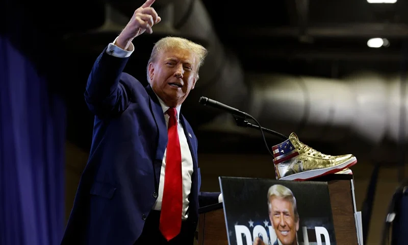 PHILADELPHIA, PENNSYLVANIA - FEBRUARY 17: Republican presidential candidate and former President Donald Trump takes the stage to introduce a new line of signature shoes at Sneaker Con at the Philadelphia Convention Center on February 17, 2024 in Philadelphia, Pennsylvania. Sneaker Con was founded in 2009 and is one of the oldest events celebrating sneakers, streetwear and urban culture. Trump addressed the event one day after a judge ordered the former president to pay $354 million in his New York civil fraud trial. (Photo by Chip Somodevilla/Getty Images)