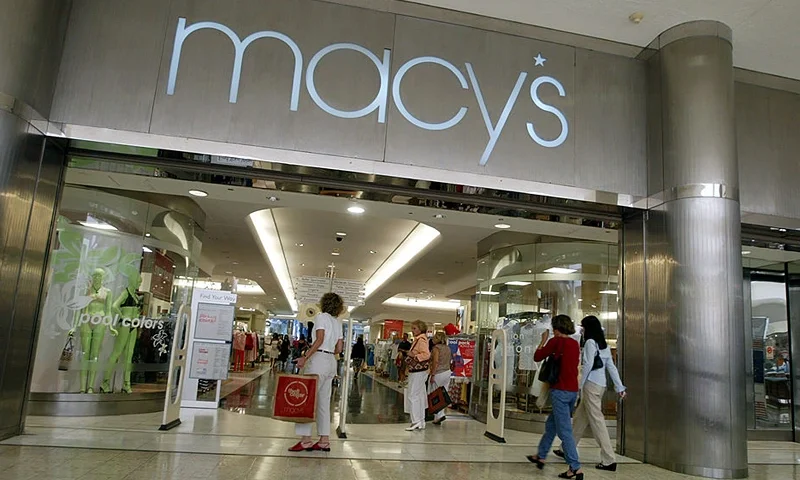 NORTH MIAMI, FL - MAY 23: Customers walk out of Macy's the day after the company announced that the 56 Burdines stores and the seven Macy's stores in Florida all will operate under the combined name of Burdines-Macy's May 23, 2003 in North Miami, Florida. The union is part of a strategy by parent company Federated Department Stores to use the national marketing clout of the Macy's name and take advantage of larger buying power. All of Federated's regional department store chains will make similar moves. The Miami-based Burdines will actually be the last one to be converted to the same name. (Photo by Joe Raedle/Getty Images)