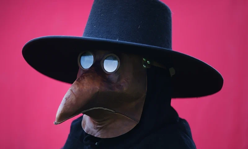 STIRLING, SCOTLAND - JUNE 28: A man dresses as a plague doctor at the Bannockburn Live event on June 28, 2014 in Stirling, Scotland. The 700th anniversary of the historic battle that saw the outnumbered Scots conquer the English led by Edward II in the First War of Scottish Independence. (Photo by Peter Macdiarmid/Getty Images)