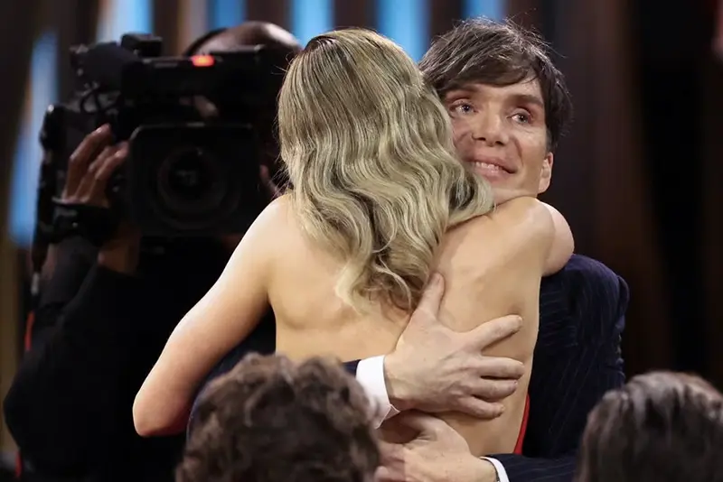 Cillian Murphy is embraced by Emily Blunt after winning Best Male Actor in a Leading Role for Oppenheimer during the 30th Screen Actors Guild Awards, in Los Angeles, California, U.S., February 24, 2024. REUTERS/Mario Anzuoni