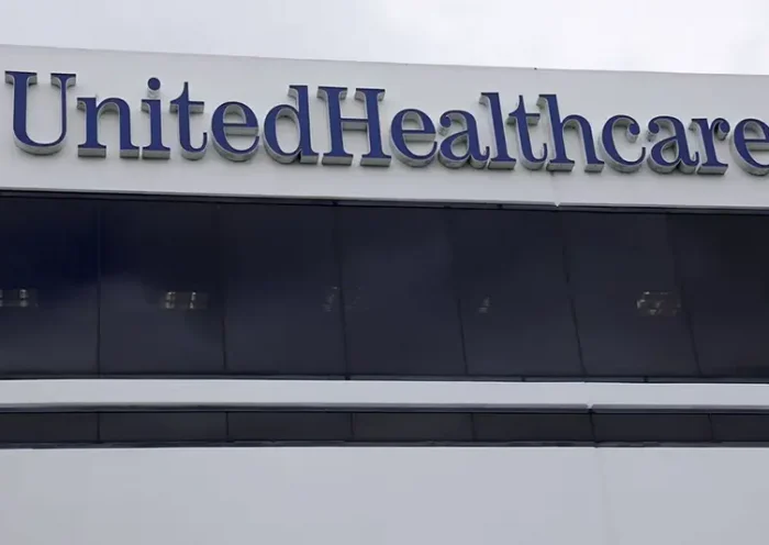 The corporate logo of the UnitedHealth Group appears on the side of one of their office buildings in Santa Ana, California, U.S., April 13, 2020. REUTERS/Mike Blake/File Photo