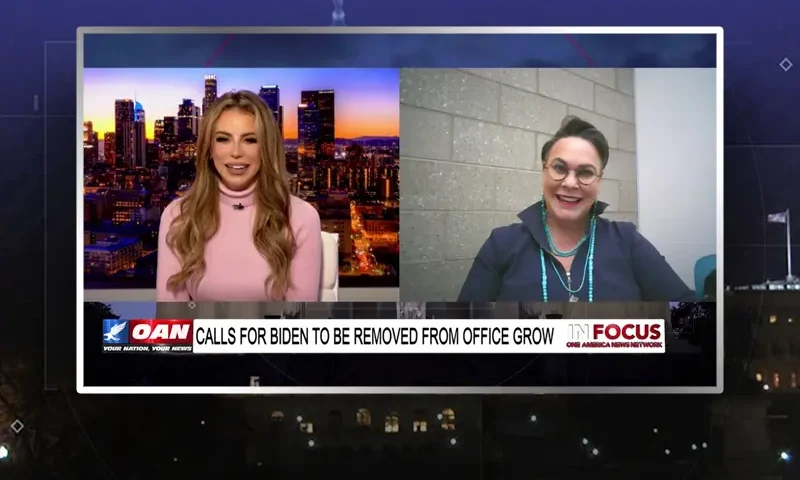 Video still from In Focus on One America News Network showing a split screen of the host on the left side, and on the right side is the guest, Rep. Harriet Hageman.