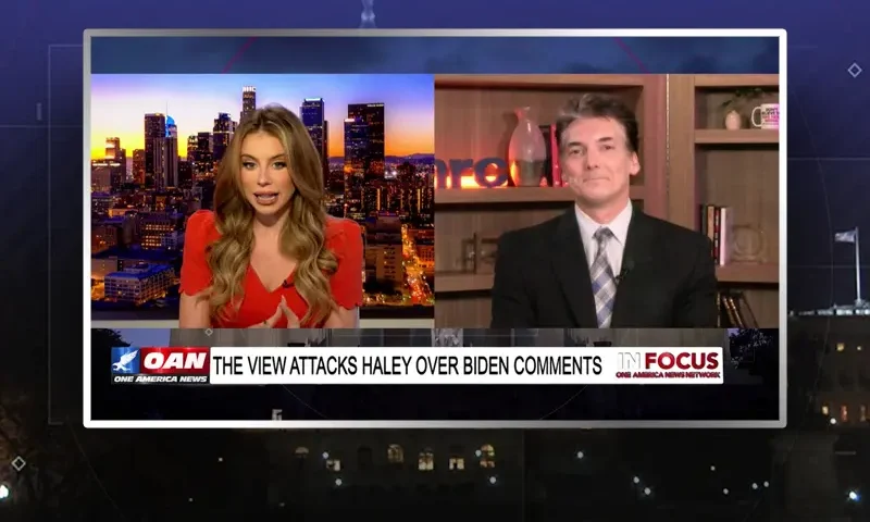 Video still from In Focus on One America News Network showing a split screen of the host on the left side, and on the right side is the guest, Eric Scheiner.