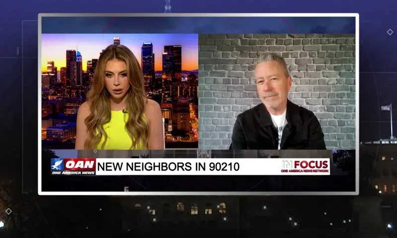 Video still from In Focus on One America News Network showing a split screen of the host on the left side, and on the right side is the guest, Michael Loftus.