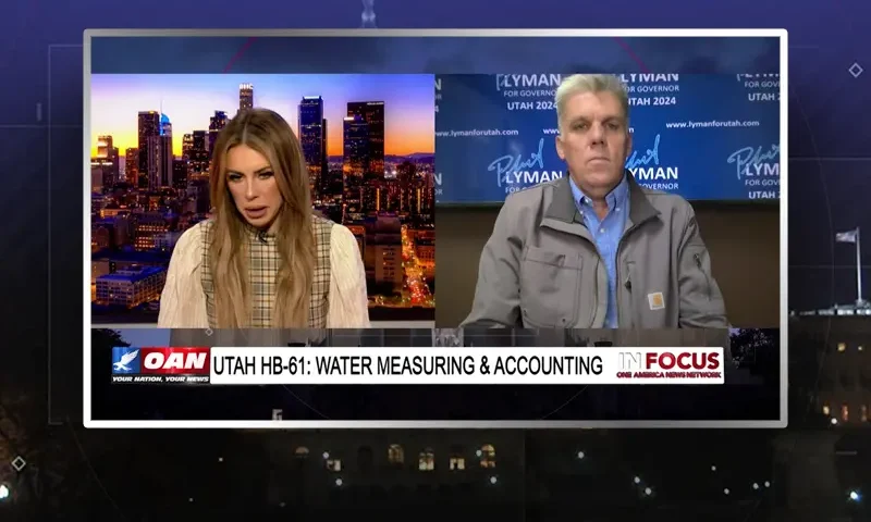 Video still from In Focus on One America News Network showing a split screen of the host on the left side, and on the right side is the guest, Phil Lyman.