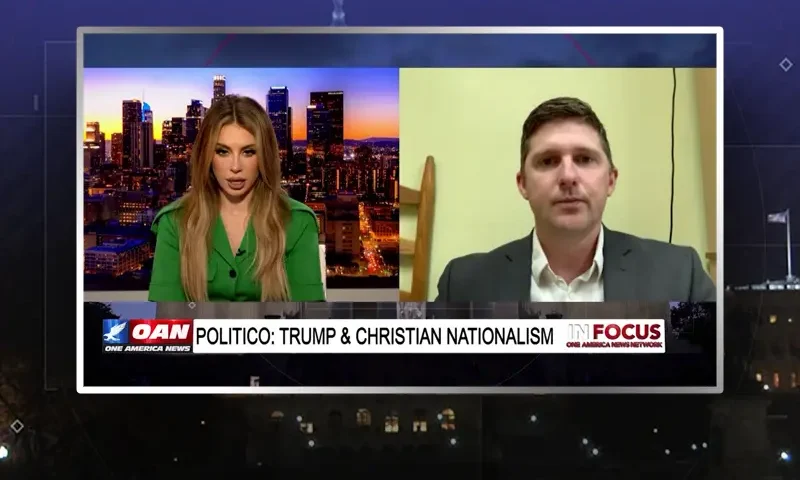 Video still from In Focus on One America News Network showing a split screen of the host on the left side, and on the right side is the guest, Derrick Evans.