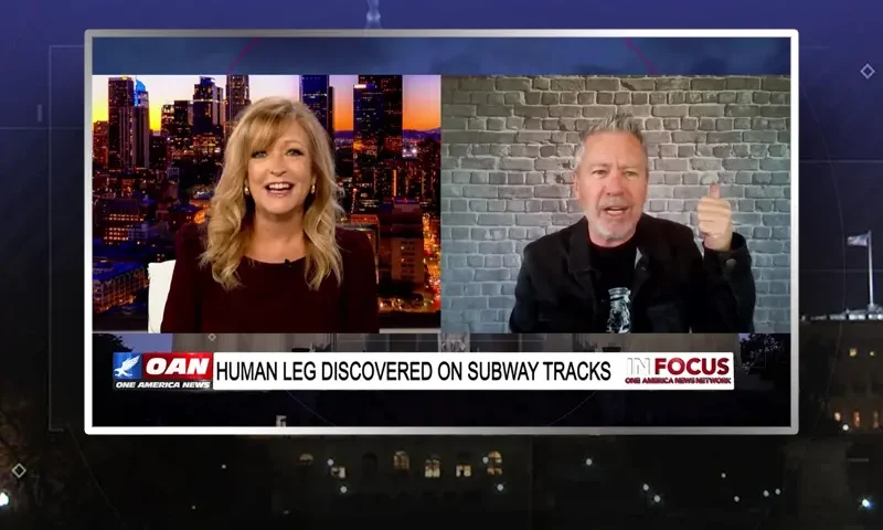 Video still from In Focus on One America News Network showing a split screen of the host on the left side, and on the right side is the guest, Michael Loftus.