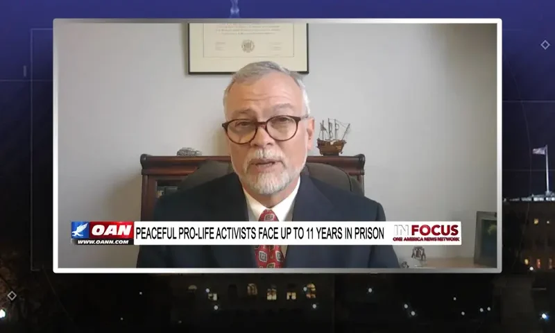 Video still from In Focus on One America News Network during an interview with the guests, Paul Vaugh and Stephen Crampton.