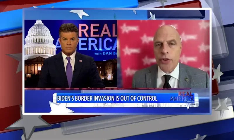 Video still from Real America on One America News Network showing a split screen of the host on the left side, and on the right side is the guest, Ron Vitiello.