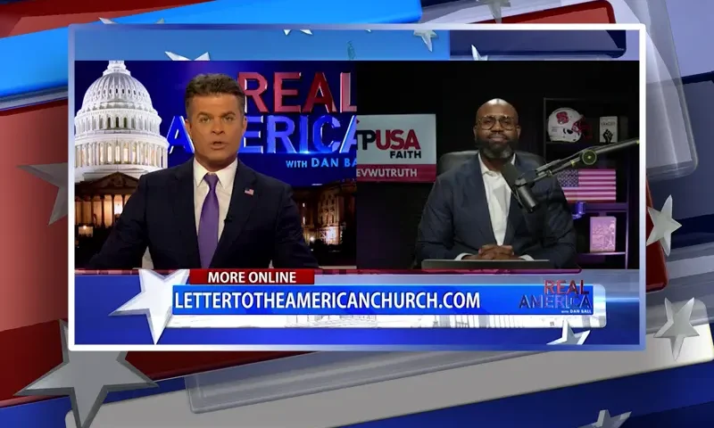 Video still from Real America on One America News Network showing a split screen of the host on the left side, and on the right side is the guest, John Amanchukwu.