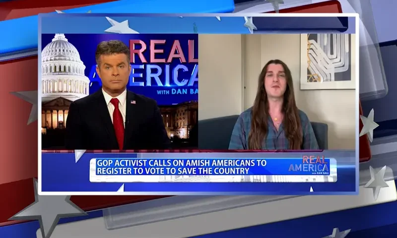 Video still from Real America on One America News Network showing a split screen of the host on the left side, and on the right side is the guest, Scott Presler.
